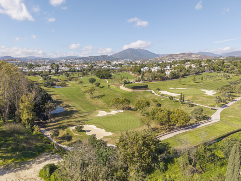 Renovated front-line golf town house with 4 bedrooms in Aloha, Nueva Andalucía, featuring communal pool and gardens, private garage, and east-facing open views.